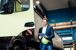 © Westend61 - Male manager using digital tablet while standing by truck