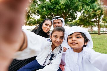 Wall Mural - Happy family spending time together outdoor in Dubai