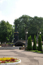 View Of The City Park. A Beautiful Bridge Over The Reservoir. Summer, In The Park.