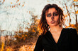 © Westend61 - Young woman with spooky Halloween make-up in forest