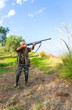 © MarcoLatino - Vertical shot of a man with his rifle hunting in the Italian countryside of Calabria