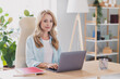 © deagreez - Photo of young beautiful peaceful businesswoman working in laptop chatting receive email document distance job