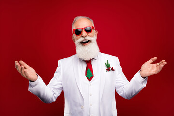 Photo of cheerful positive happy old man wear sunglass good mood showman new year isolated on red color background