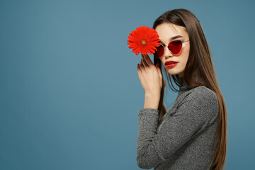 Wall Mural - pretty woman red lips posing fashion blue background