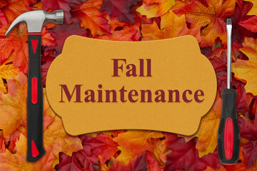 Wall Mural - Fall Maintenance message with a hammer and screwdriver on leaves