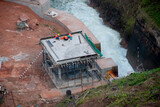 Fototapeta Lawenda - The building under construction is attached to the water source.