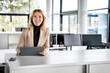 © Westend61 - Beautiful female professional with digital tablet in office
