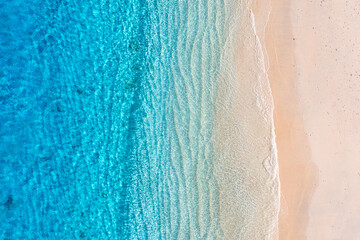 Beach and ocean as a background from top view. Azure water background from top view. Summer seascape from air. Travel and vacation image