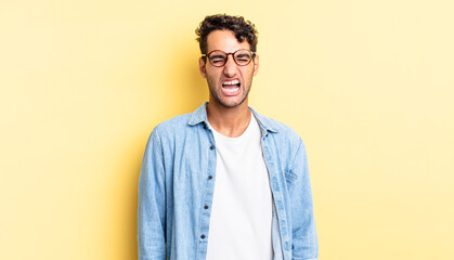 Wall Mural - hispanic handsome man shouting aggressively, looking very angry