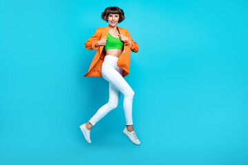 Poster - Full size photo of pretty nice young woman jump up air wear blazer good mood isolated on blue color background