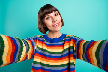 Sticker - Photo portrait smiling bob haired woman in casual clothes taking selfie showing tongue isolated bright teal color background