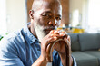 © Wavebreak Media - Portrait of thoughtful senior african american man in living room holding walking cane