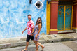 Beautiful tourist couple walking in the colorful streets of Cartagena de Indias, Colombia