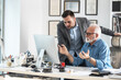 © BalanceFormCreative - Young businessman  discuss  with his manager how to solve problem.Working day at the office.