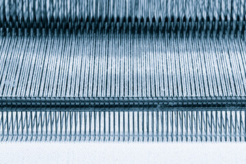 Fototapete - straight strands texture background, sewing equipment, loom equipment at a garment factory