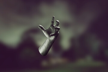 Poster - Creepy severed human hand in an eerie setting on blurred scary background