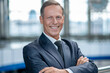 © zinkevych - Smiling business man standing at airport