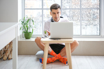 Sticker - Young businessman working at home