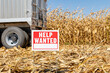 © JJ Gouin - Help wanted sign in farm field. Farm labor shortage, agriculture job market and employment concept