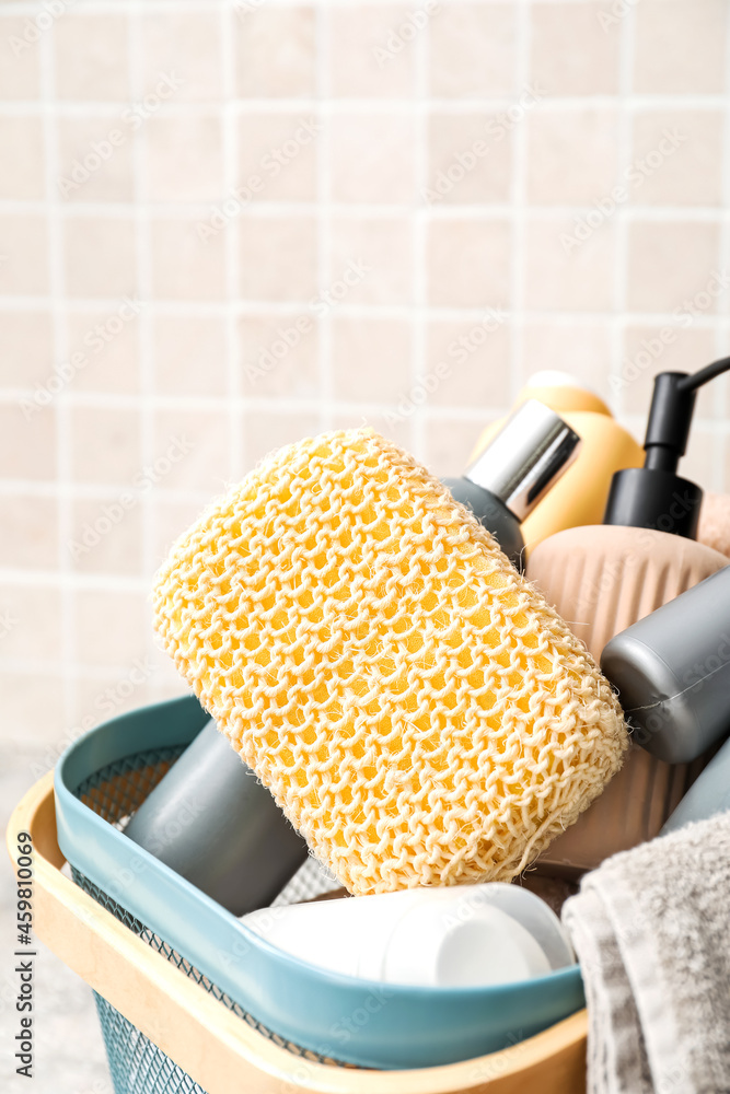 Loofah sponge with bath supplies in basket