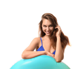 Wall Mural - Young woman with inflatable ring on white background