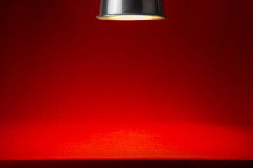 Wall Mural - Red scene with spotlight and spot of light and edge of ramp. Abstract classic theatre stage background for design, showing, presentation.