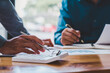 © crizzystudio - Business meeting Financing Accounting Concept.  businessman investment consultant analyzing company financial report balance sheet statement working with digital graphs.