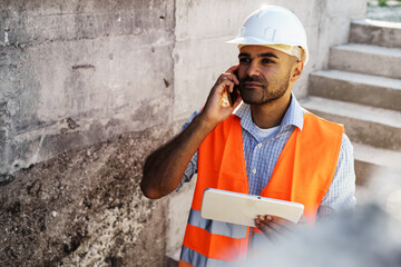 Wall Mural - Portrait of young construction engineer wearing hardhat