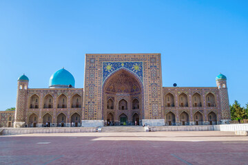 Wall Mural - Facade of Tilya Kori Madrasah, one of the most famous and oldest buildings in Samarkand, Uzbekistan. Building is decorated with traditional Eastern ornaments and patterns