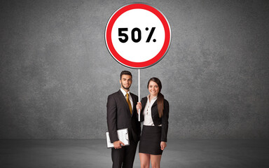 Young business person holdig traffic sign concept