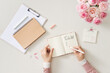 © Cavan Images - To do list. Female home office workspace table