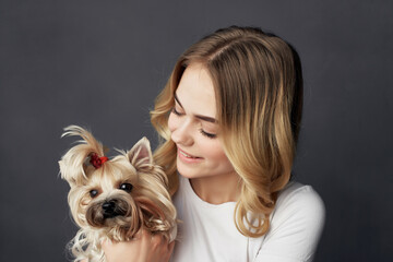 Wall Mural - pretty woman with a small dog makeup posing cropped view