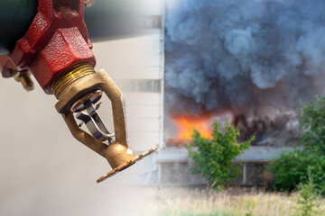 Sprinkler for fire protection. Sprinkler next to street flame. Concept - spray of water to extinguish flame. Fire fighting equipment. Sprinkler next to puffs of black smoke. Selective focus