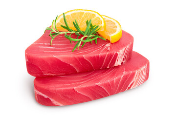 Fresh tuna fish fillet steak with rosemary and lemon isolated on white background with clipping path and full depth of field