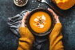 © somegirl - Female hands with bowl of pumpkin soup