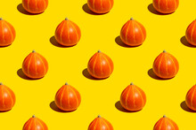 Seamless Pattern Of Ripe Juicy Whole Autumn Orange Pumpkins On Yellow Background