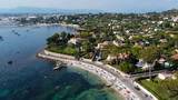Fototapeta Na drzwi - Aerial view of Ondes Beach on the Cap d'Antibes in the French Riviera - Ruins of a flooded round watch tower in the Mediterranean Sea