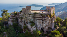 Aerial View Of The Ruins Of The Castle Of Eze Village, A Famous Stone Village Built On A Rocky Overlook High Above The Mediterranean Sea On The French Riviera, In The South Of France