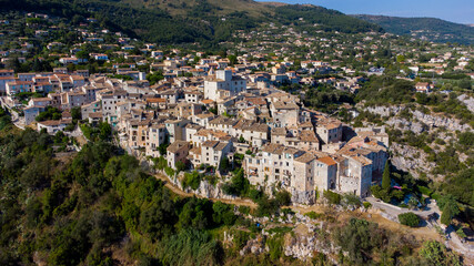 Wall Mural - Aerial view of the medieval village of Tourrettes sur Loup in the mountains above Nice on the French Riviera, France - Old stone houses nestled on a belvedere in Provence