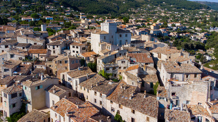 Wall Mural - Aerial view of the medieval village of Tourrettes sur Loup in the mountains above Nice on the French Riviera, France - Old stone houses nestled on a belvedere in Provence