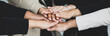 Close up shot of holding hands of unidentified unrecognizable successful female businesswoman group together in formal business suit wears empower encourage as trust teamwork partnership agreement