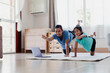 © pingpao - Asian young mother and her daughter doing stretching fitness exercise yoga together at home. Parent teaching child work out to be strong and maintain physical health and wellbeing in daily routine.