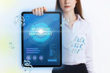 Business, Technology, Internet and network concept. Young businessman working on a virtual screen of the future and sees the inscription: Inventory management