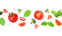 Flying Fresh Vegetables And Herbs On White Background