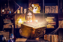 Surprised Little Girl In Witch Cosplay Costume From Harry Potter Holds Magic Book Halloween Concept