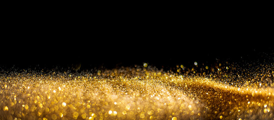 Wall Mural - blurred glitter bombs, gold glitter defocused abstract twinkly lights grunge background.
