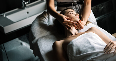 Wall Mural - Young beautiful woman having massage in spa salon