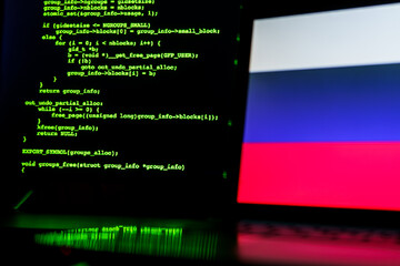 russian anonymous hackers. russian flag and programming code in background