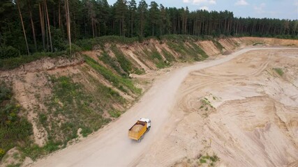 Wall Mural - Dump truck transported sand from the open pit. Tipper trucks  working in quarry. Arial view of the lorry in opencast mine. Sand and gravel is excavated from ground. Mining industry.