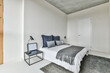 © ADDICTIVE STOCK - Contemporary bedroom interior with bed and nightstand